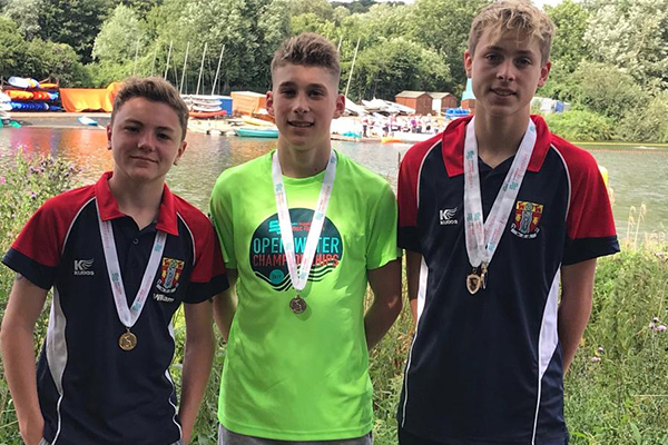 William, Charlie and Henry with open water medals